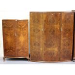 A George V walnut gentleman's bowfront wardrobe, the two doors revealing hanging space and