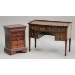 An early 20th century mahogany kneehole side table, fitted with four drawers, on square tapering