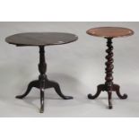 A George III provincial oak circular tip-top wine table, raised on a turned column and tripod