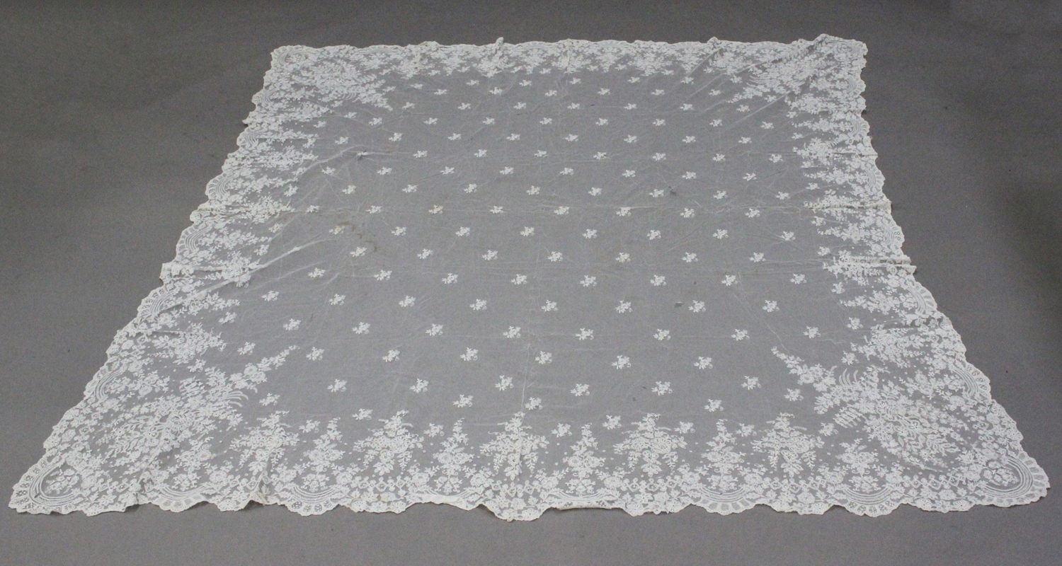 A late 19th/early 20th century Continental white net and lacework wedding veil with a foliate border