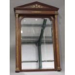 A 20th century Empire style mahogany framed and gilt metal mounted pier mirror with arched