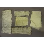 A group of mainly 19th century lacework, including headpieces, a pair of cuffs, various panels,