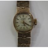 A Rotary 9ct gold lady's bracelet wristwatch, the signed silvered dial with baton hour markers, on a