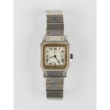 A Cartier Santos steel and gold gentleman's bracelet wristwatch, the signed cream coloured dial with