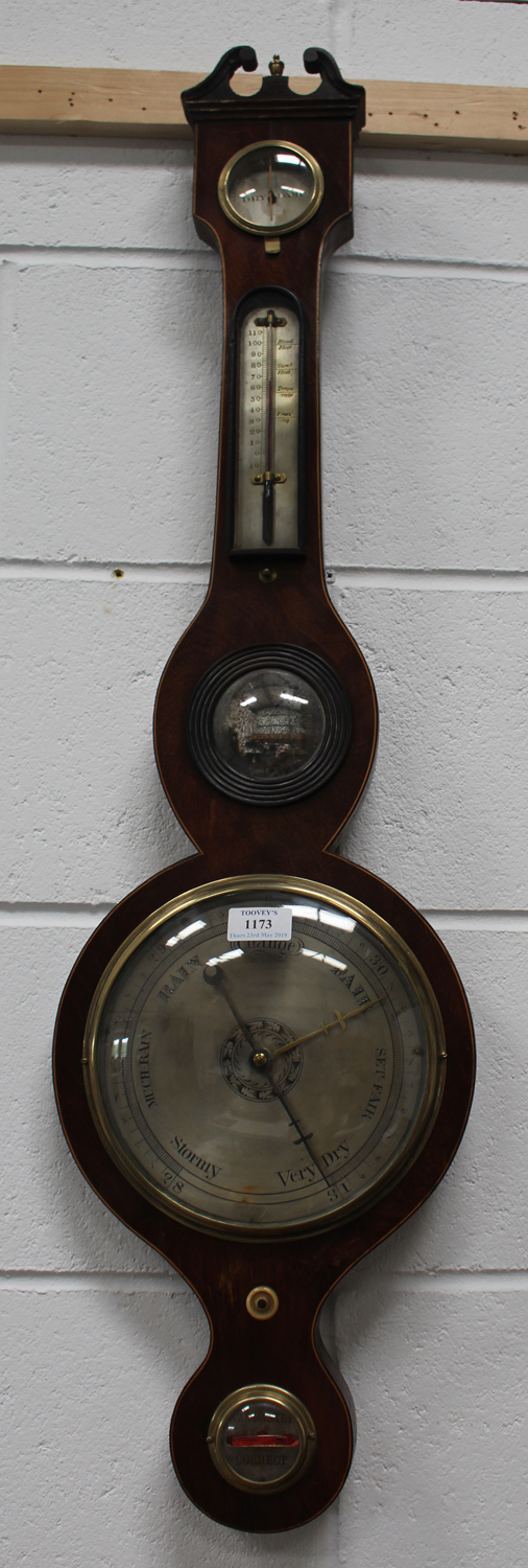 An early 19th century mahogany wheel barometer with alcohol thermometer, silvered dials, convex