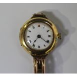 A 15ct gold circular cased lady's wristwatch with an unsigned jewelled movement, numbered within the