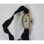 A Rolex 18ct gold shaped oval cased lady's wristwatch, the signed jewelled movement detailed '