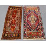 A small Turkish rug, late 20th century, the deep claret field with an angular medallion, within a
