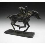A 20th century cast bronze model of a jockey on horseback, raised on a rectangular base, height