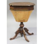 An early Victorian rosewood work table, the hinged top above a well, raised on a turned column and