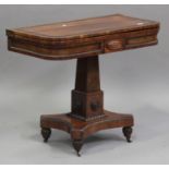 A Regency rosewood fold-over tea table, the hinged top with a coromandel crossbanded border,