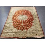 A fine part silk Tabriz rug, Central Persia, modern, the bright chestnut field with a foliate