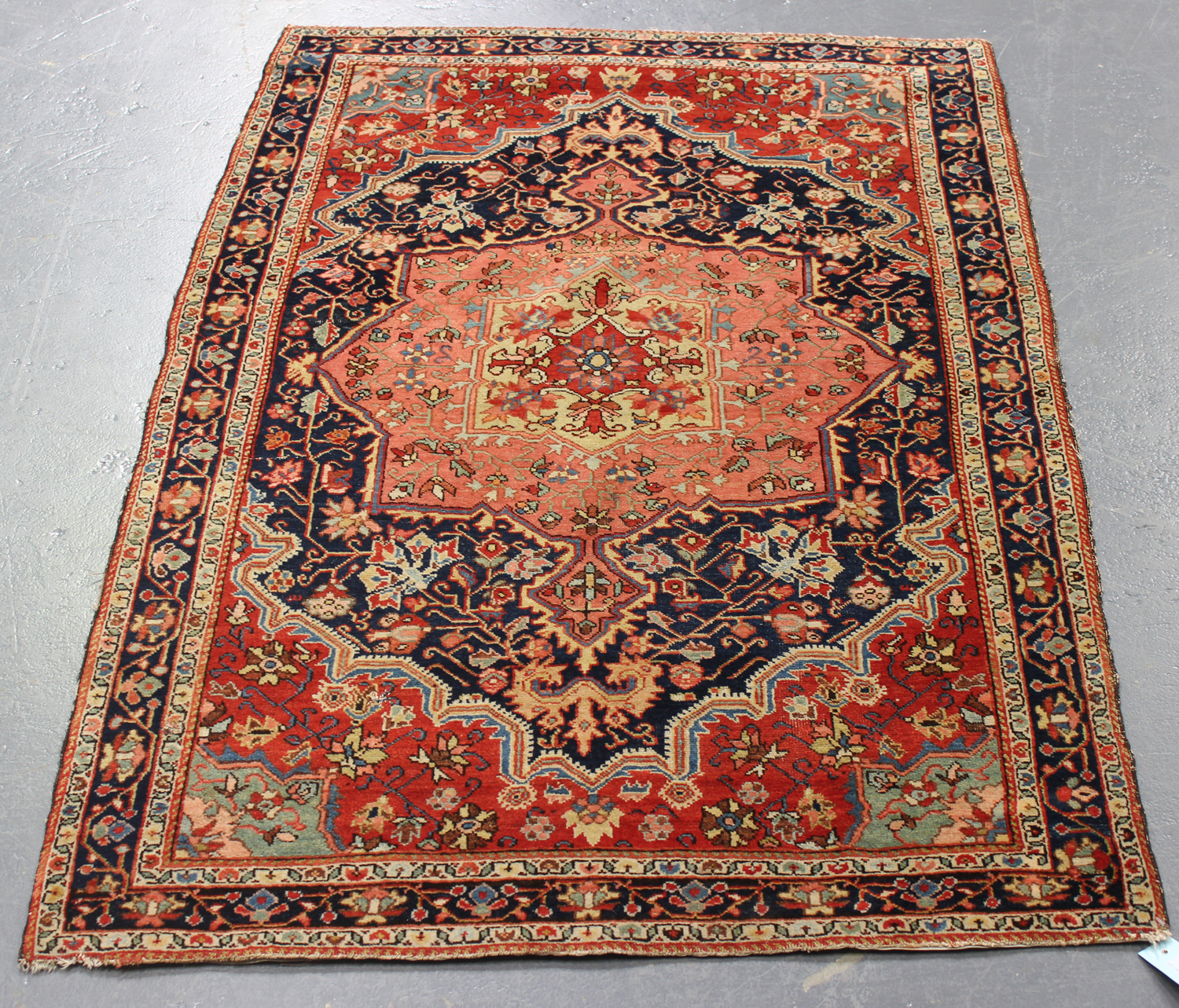 A Heriz rug, North-west Persia, early 20th century, the blue field with a bold salmon pink