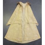 A Victorian cream fabric baby's tiered cape, embroidered in ivory silk with trailing foliage and
