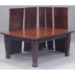 A large early 20th century Neoclassical Revival mahogany extending dining table, the moulded top