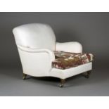 An Edwardian Howard & Sons 'Bridgewater' armchair, the scroll back and arms upholstered in calico,