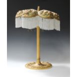 A 20th century Art Nouveau style cast ormolu six light table lamp, the lobed shade pierced and