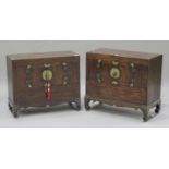 A near pair of 20th century South-east Asian stained softwood low side cabinets, each fitted with