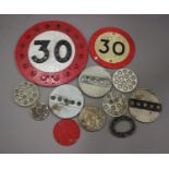 A mid-20th century cast alloy 30mph speed limit road sign, inset with reflectors, diameter 45cm,