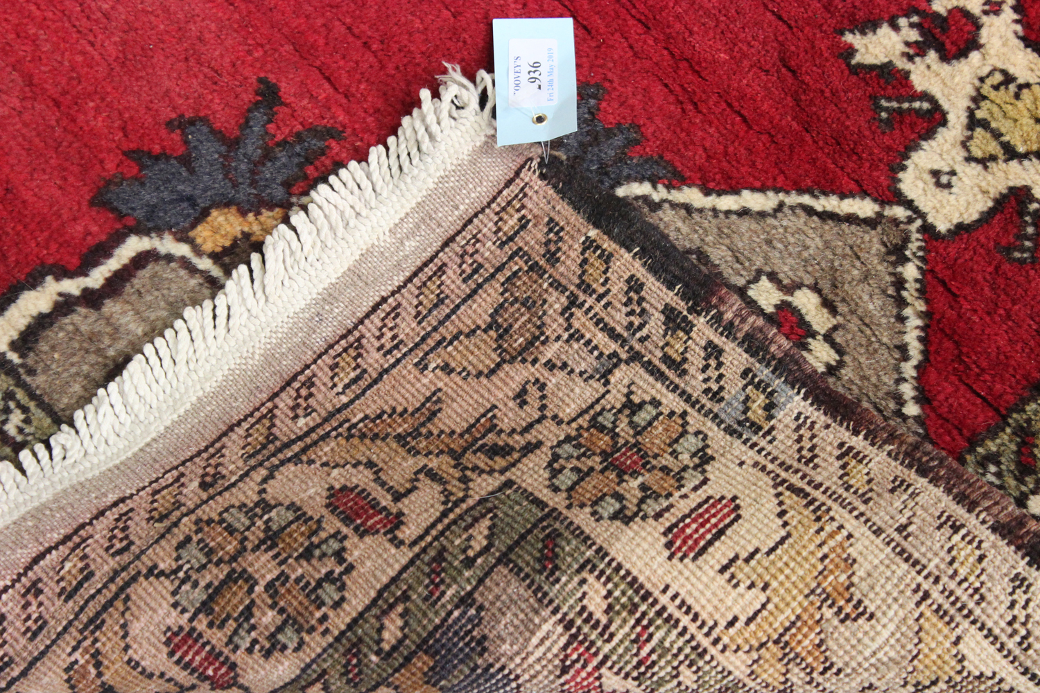 A Turkish rug, mid-20th century, the red field with a lobed medallion and shaped spandrels, within - Image 2 of 2