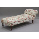 A late 19th/early 20th century drop-end day bed, upholstered in cream chinoiserie style fabric,