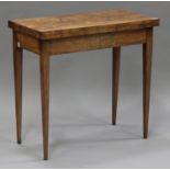 A 19th century walnut fold-over card table, the quarter-veneered top raised on square tapering legs,