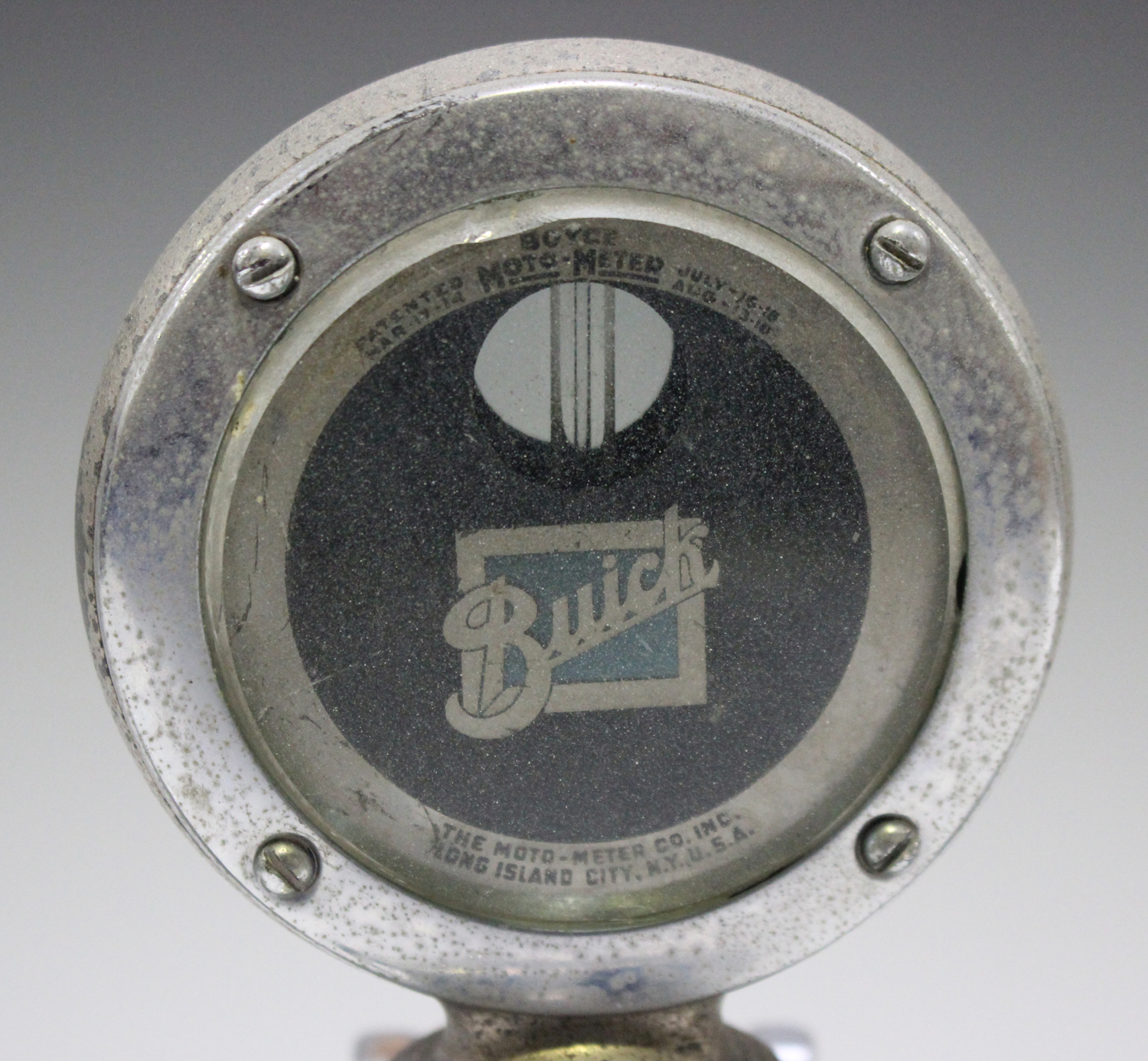 A Boyce Moto-Meter for a Buick motor car, with chromium plated finish and quick release cap, flanked - Image 6 of 6