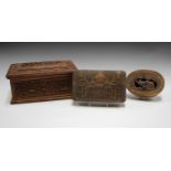 A 19th century Burmese carved sandalwood box, the lid and sides profusely carved with wild animals