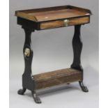 An early 19th century mahogany and ebonized writing table, possibly Irish, the gallery top above a
