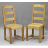 A set of eight modern oak ladder back dining chairs with solid seats and block legs, height 103cm,