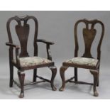 A set of eight early 20th century Queen Anne style oak framed dining chairs, comprising two