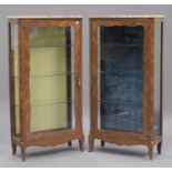 A pair of 20th century French kingwood vitrines, each with a shaped marble top above a glazed