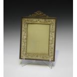 An early 20th century French gilt metal and embroidered rectangular photograph frame with flaming