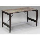 A 20th century stained pine folding trestle table, the rectangular top raised on square tapering