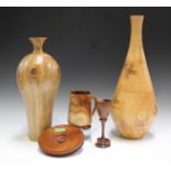A small group of late 20th century turned treen items, including a monkey puzzle vase, height