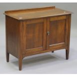 An early 20th century oak side cabinet, fitted with a pair of doors, on square tapering legs, height