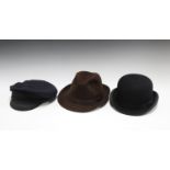 A black bowler hat by Austin Reed of Regent Street, head circumference 58cm, together with a brown