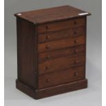 A late Victorian stained pine table-top collector's cabinet, fitted with six drawers, on a plinth