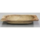 An early 20th century carved softwood dough trough, length 115cm.Buyer’s Premium 29.4% (including