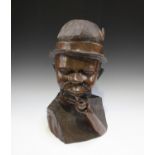 A late 20th century African carved hardwood bust, Malawi, modelled as a man wearing a hat and