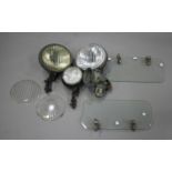 Two Notek car lamps, a Hella spot lamp, two spare lenses, a Lucas motorcycle lamp and a pair of
