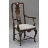 An early 20th century Queen Anne style walnut splat back scroll armchair with drop-in seat, raised