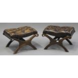 A pair of late 20th century brown buttoned leather 'X' frame footstools, height 40cm, width 58cm,