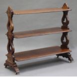 A Victorian mahogany three-tier buffet, raised on pierced supports and bracket feet, height 115cm,