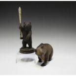 An early 20th century Swiss Black Forest carved softwood quill stand in the form of a bear, height