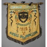 An early 20th century Belgian Art Nouveau fabric carnival banner, painted with an African style mask