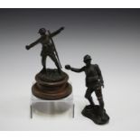 An early 20th century brown patinated cast bronze figure of a British soldier, the base titled '