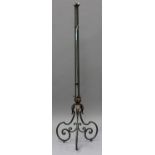 A 20th century French green and gilt painted wrought metal lamp standard, height 146cm.Buyer’s