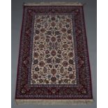 A fine Nain rug, Central Persia, mid-20th century, the ivory field profusely decorated with