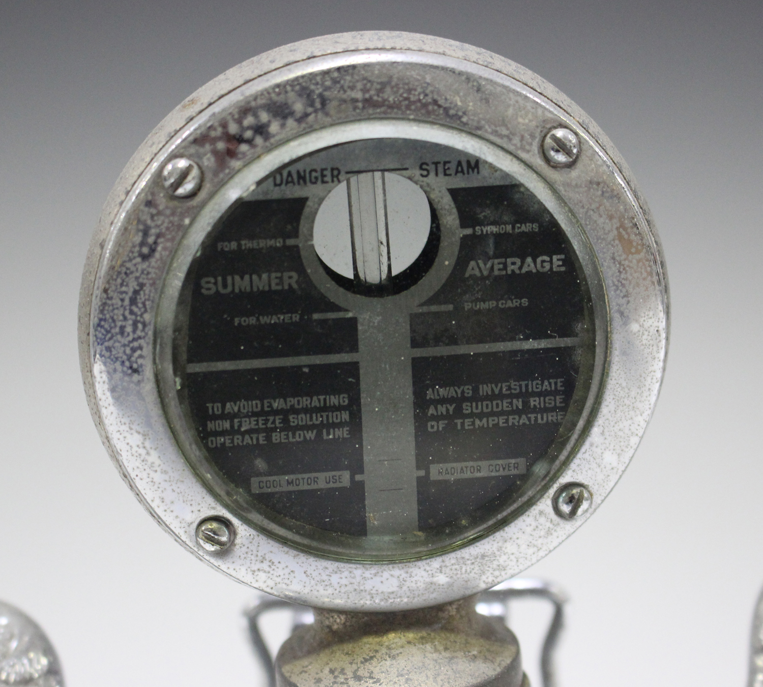 A Boyce Moto-Meter for a Buick motor car, with chromium plated finish and quick release cap, flanked - Image 3 of 6